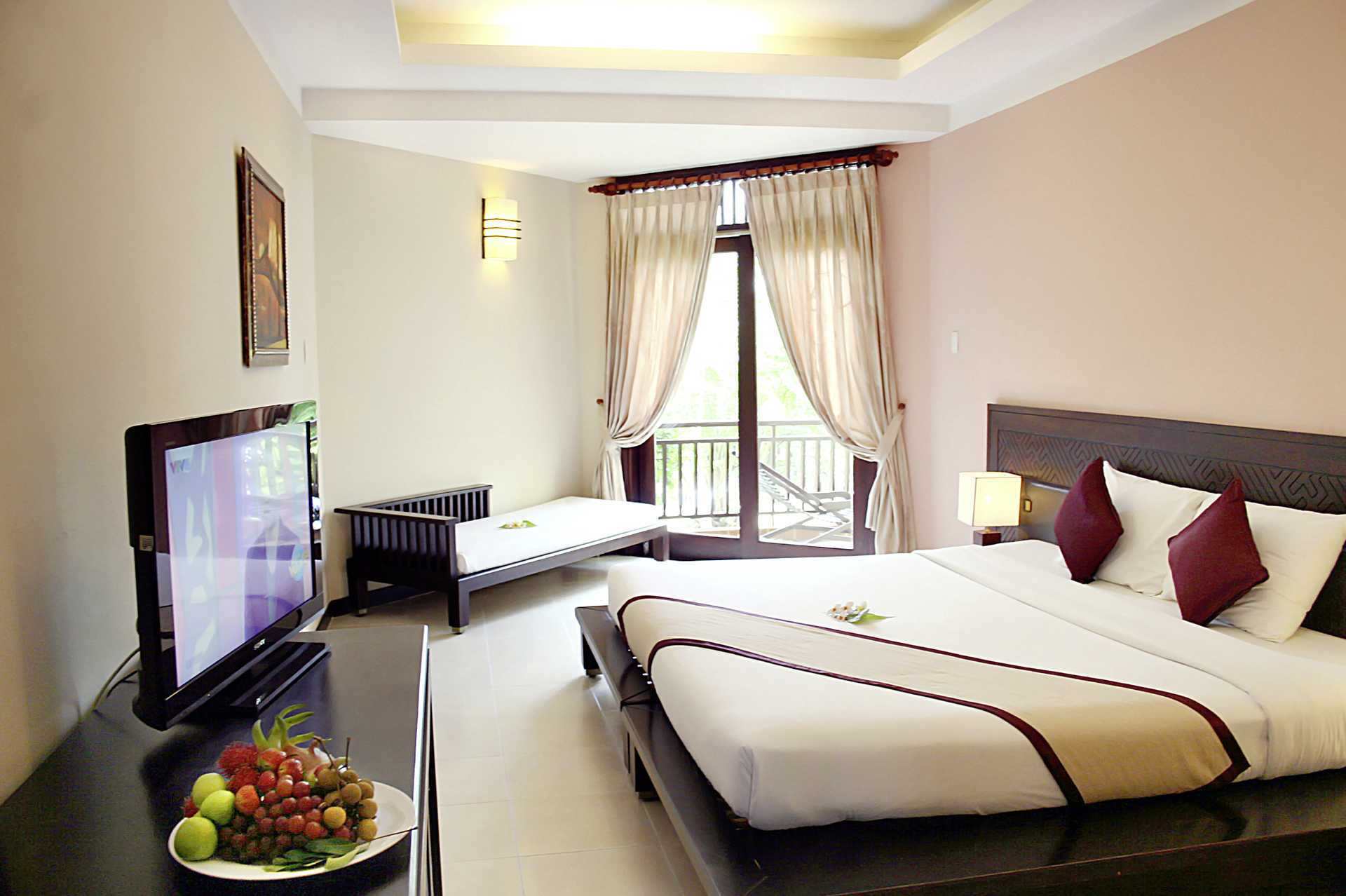Deluxe-huone Hotelli Romana Beach Resortissa Phan Thietissä, Vietnamissa.